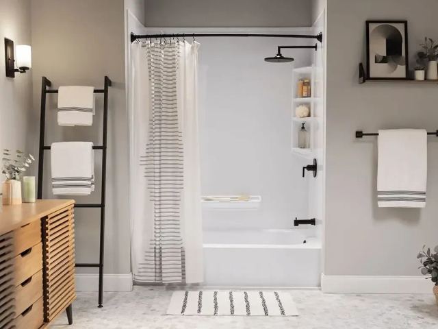 Bathtub remodel with black matte finishes