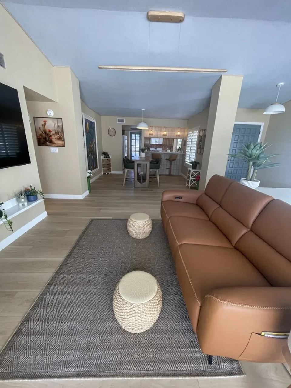 Open-concept LVP flooring through living, dining and kitchen in a Phoenix AZ home remodel