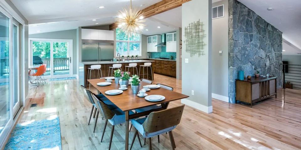 A modern kitchen with hardwood floors and a dining table home remodel San Francisco dream kitchen.