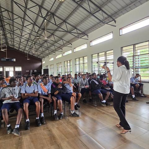 Students fill a school hall for a space-science seminar.