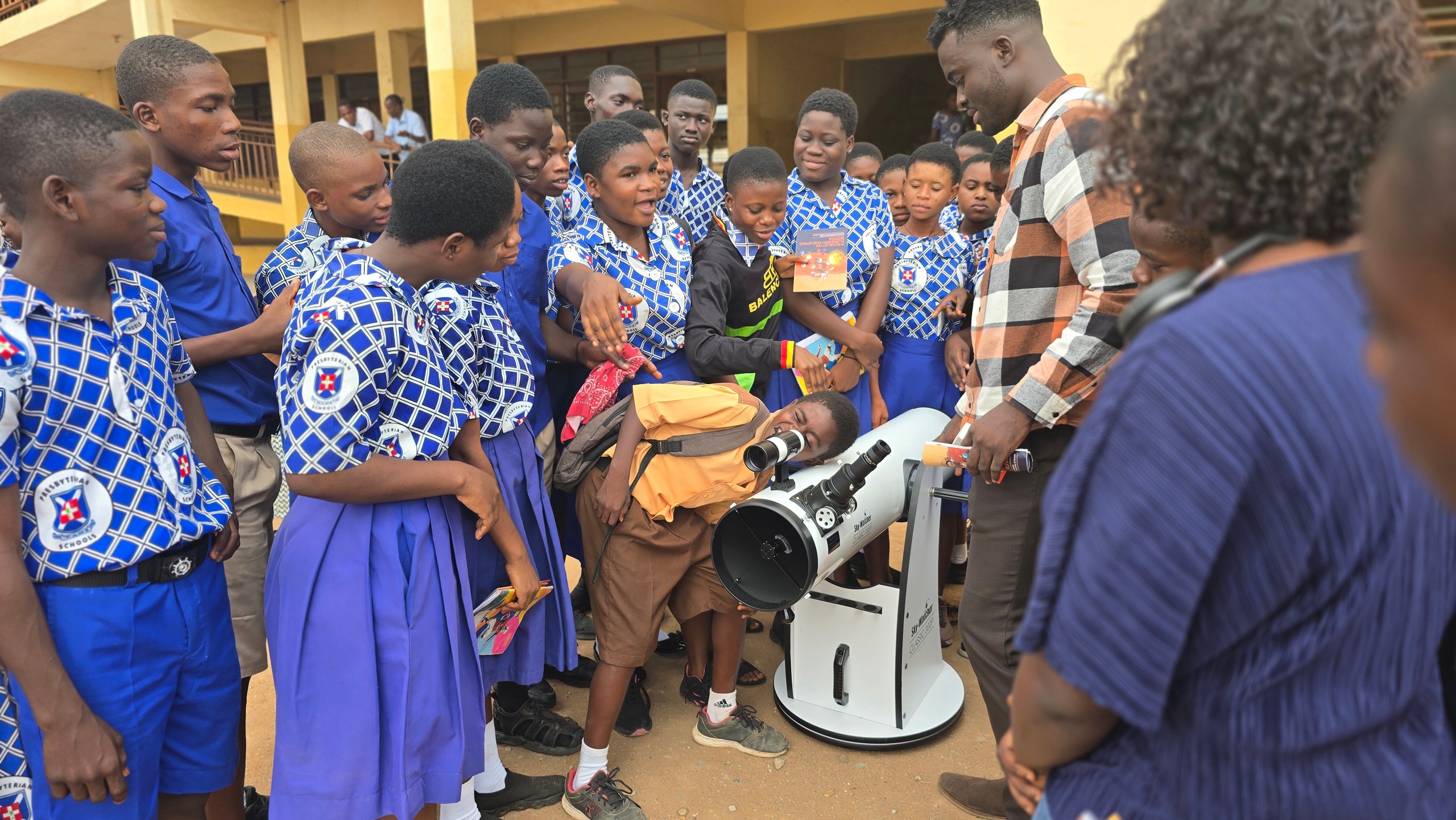 Lining up for a turn at the eyepiece during a school visit.