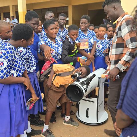 Lining up for a turn at the eyepiece during a school visit.