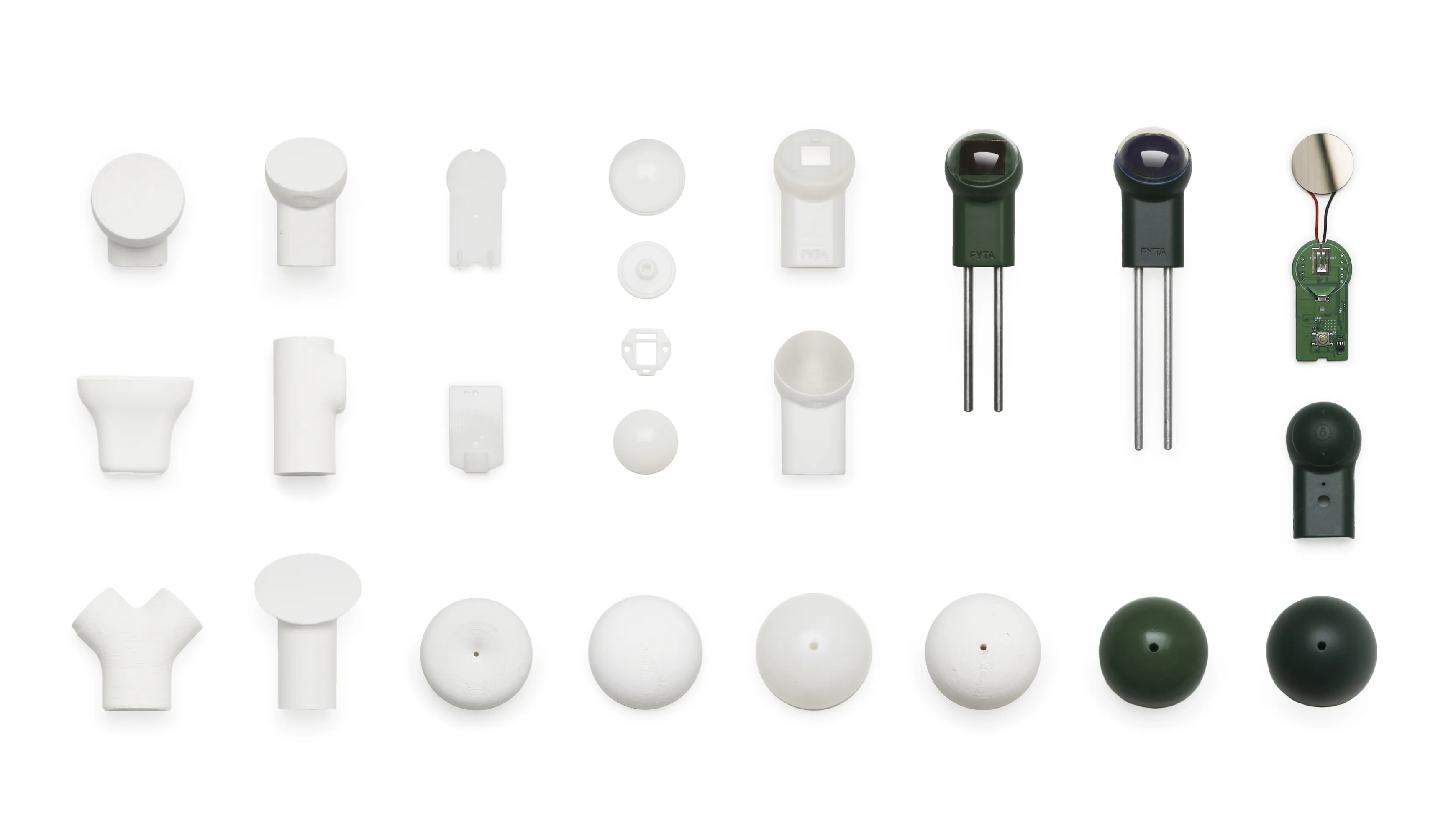 a flat lay of different 3D printed models of the Fyta smart plant sensor