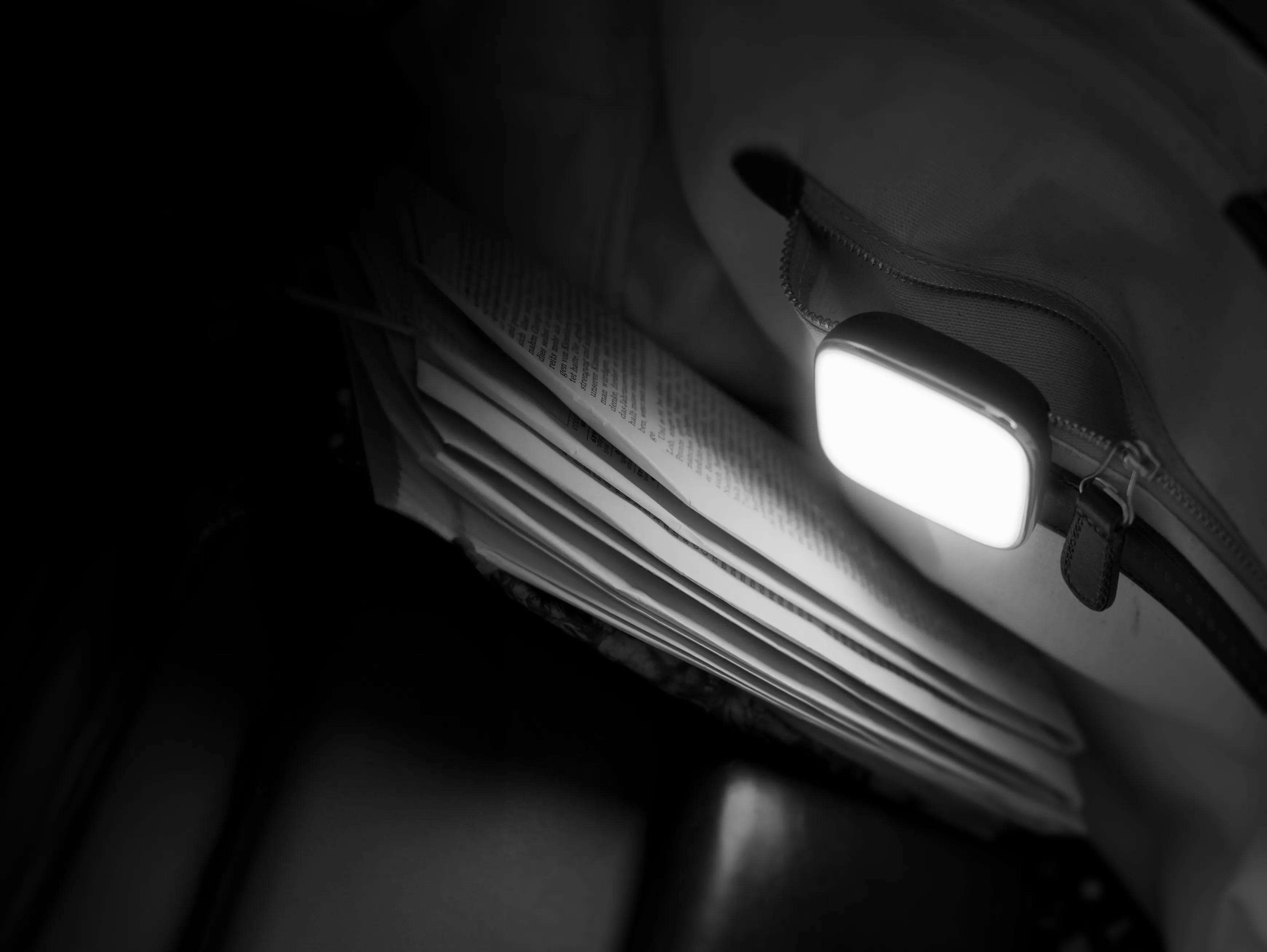 A Osram LED lamp shining on a newspaper