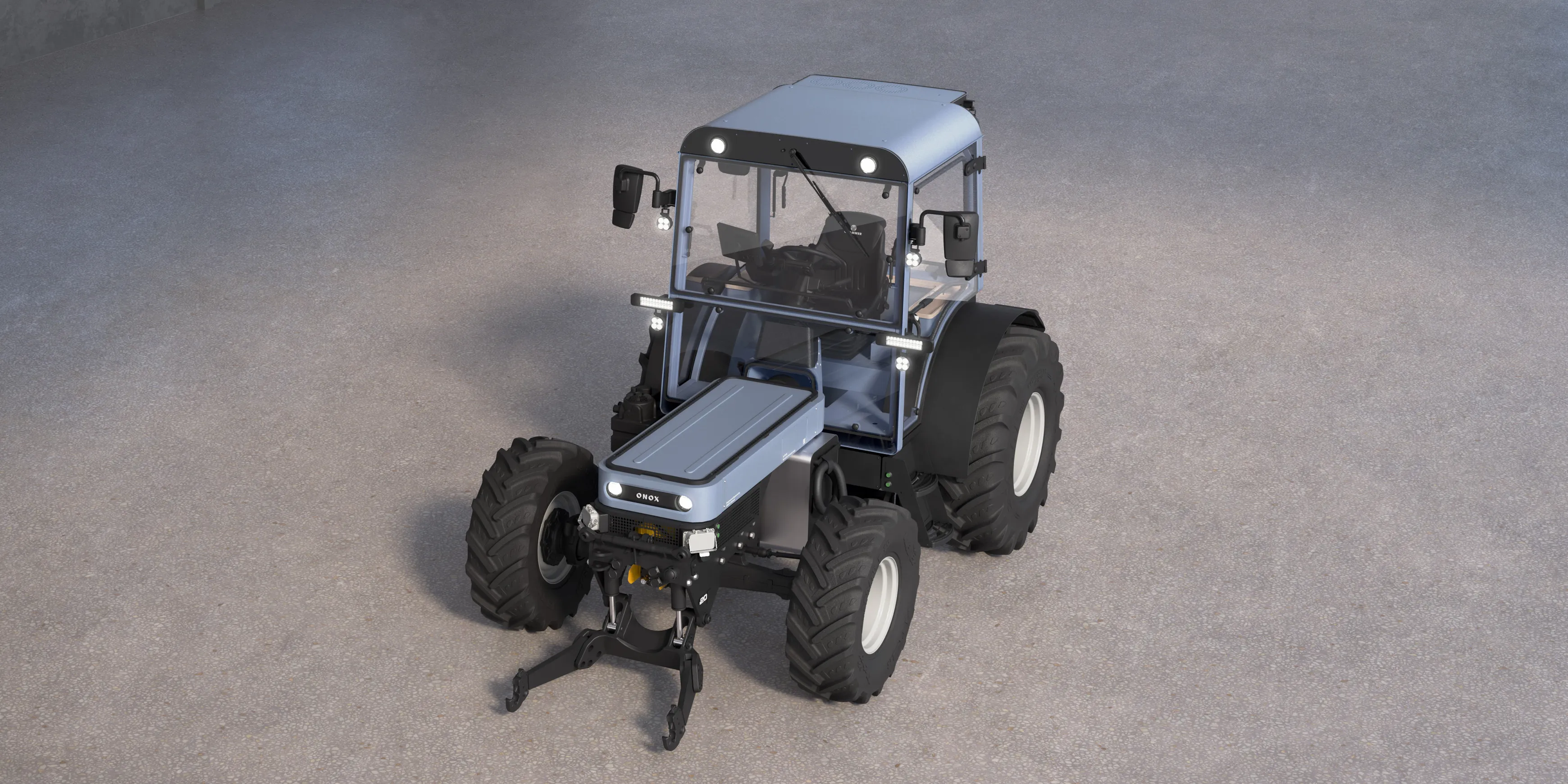 A frontal perspective view of the Onox electric tractor on a concrete floor