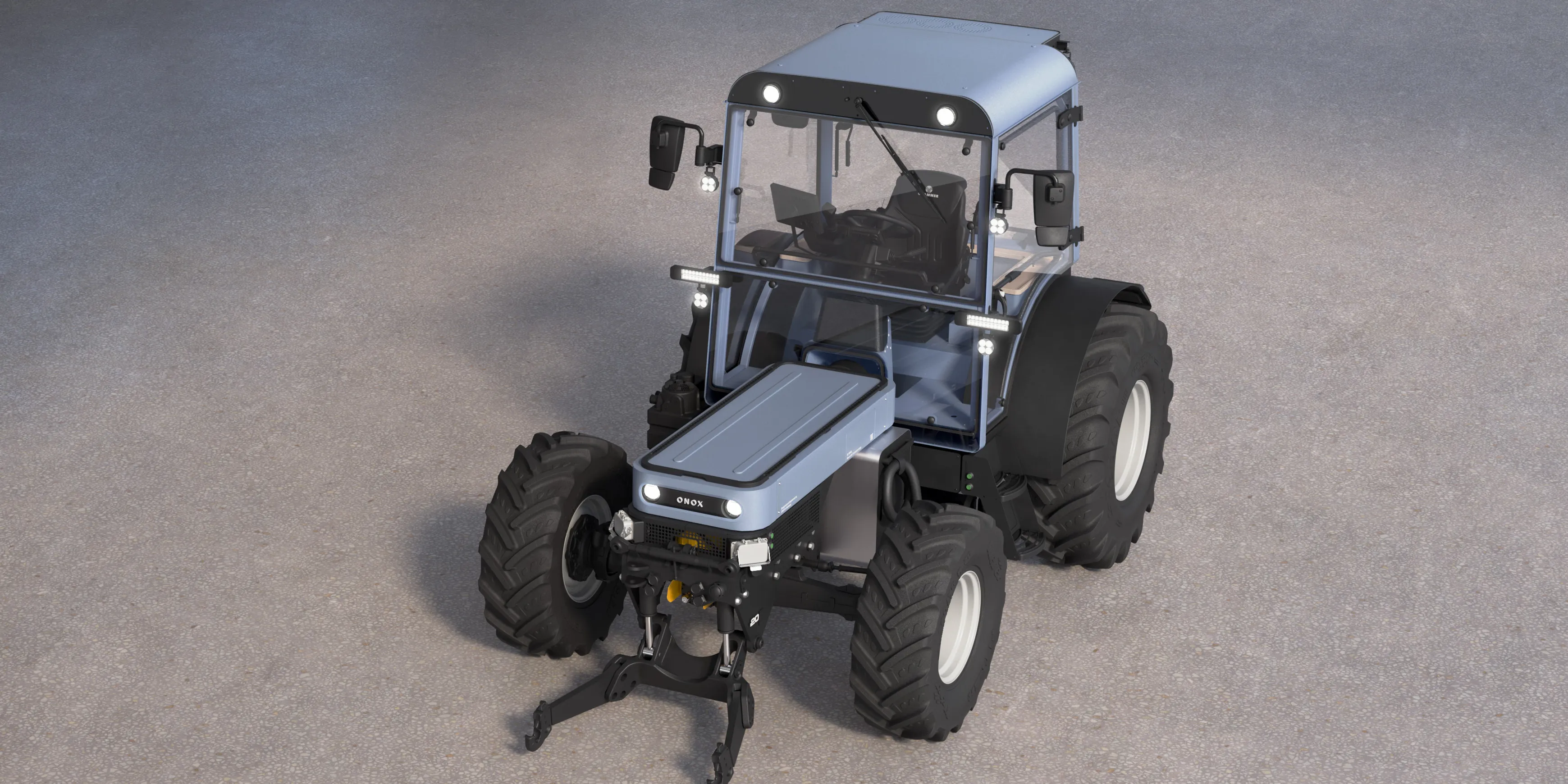 A frontal perspective view of the Onox electric tractor on a concrete floor