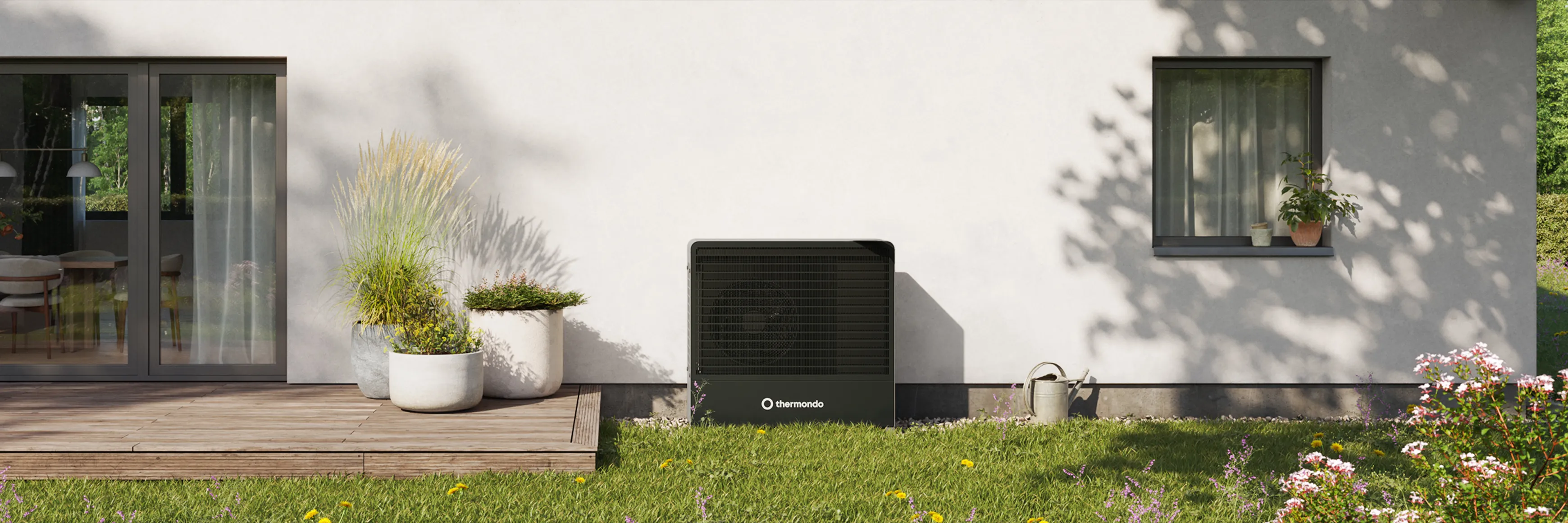A thermondo heat pump cover in front of a house in a garden