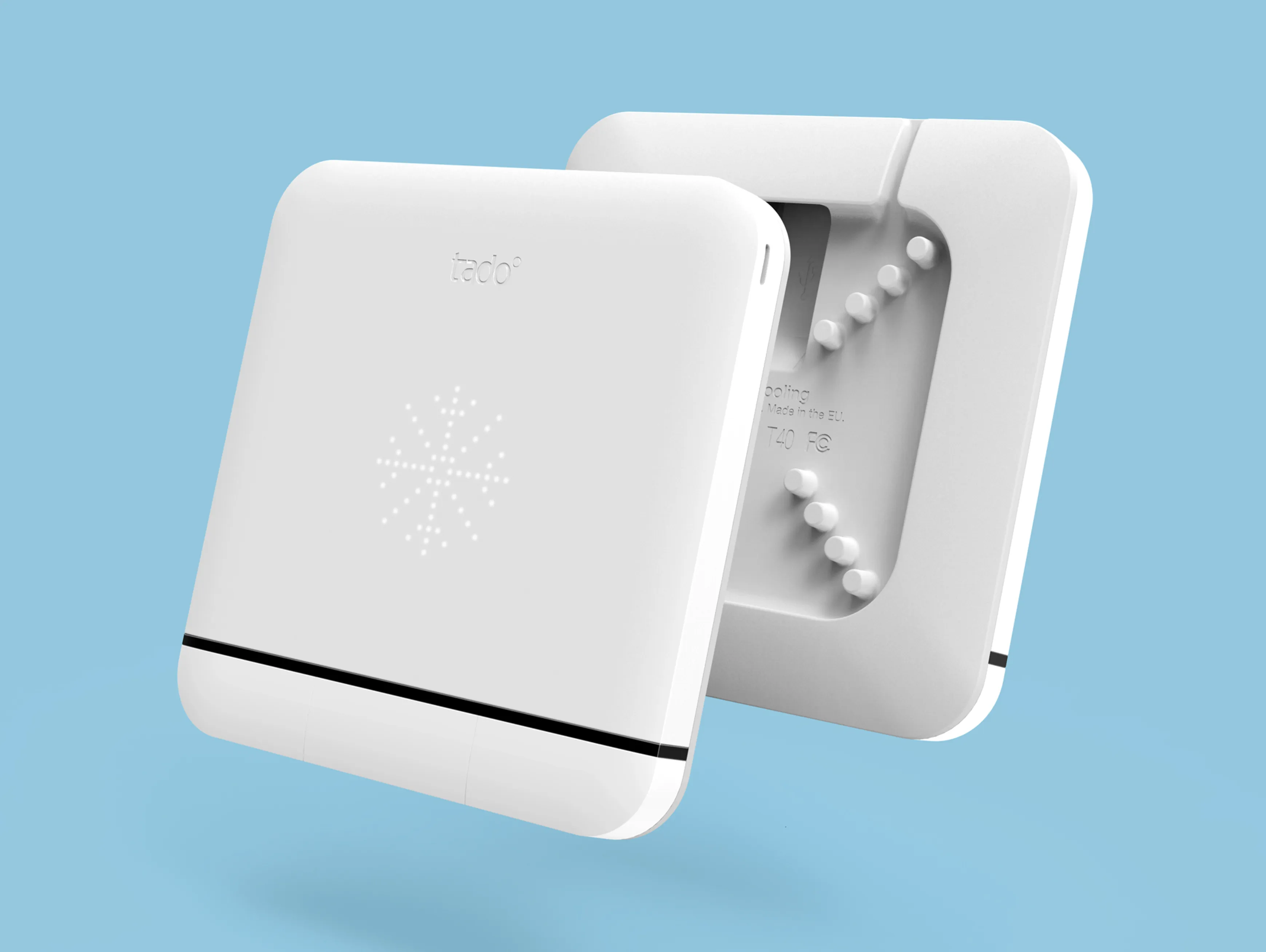 Two tado smart AC controls floating back to back in front of a blue background