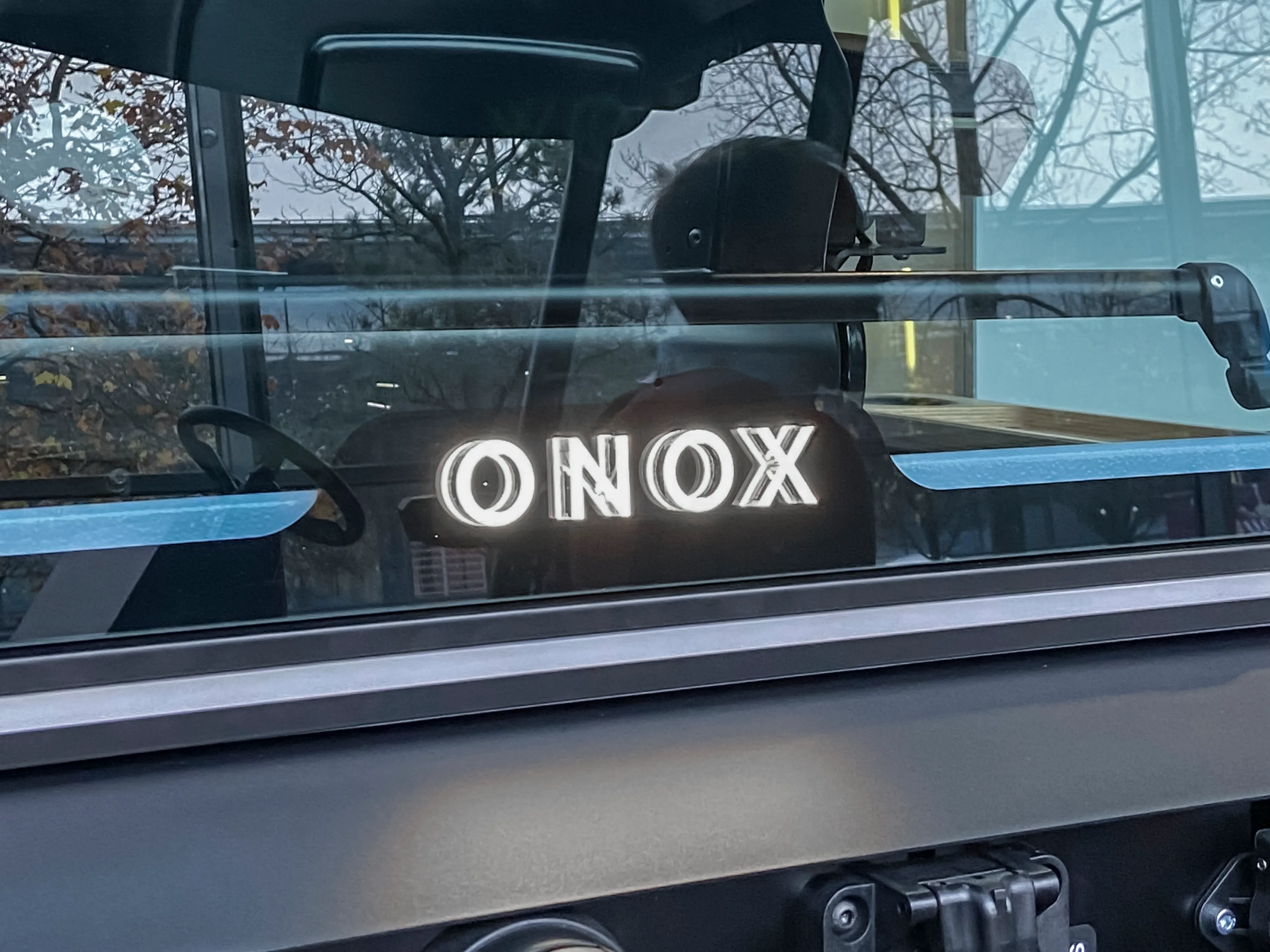 A detail of the Onox tractor from the rear windshield showing the glowing logo type