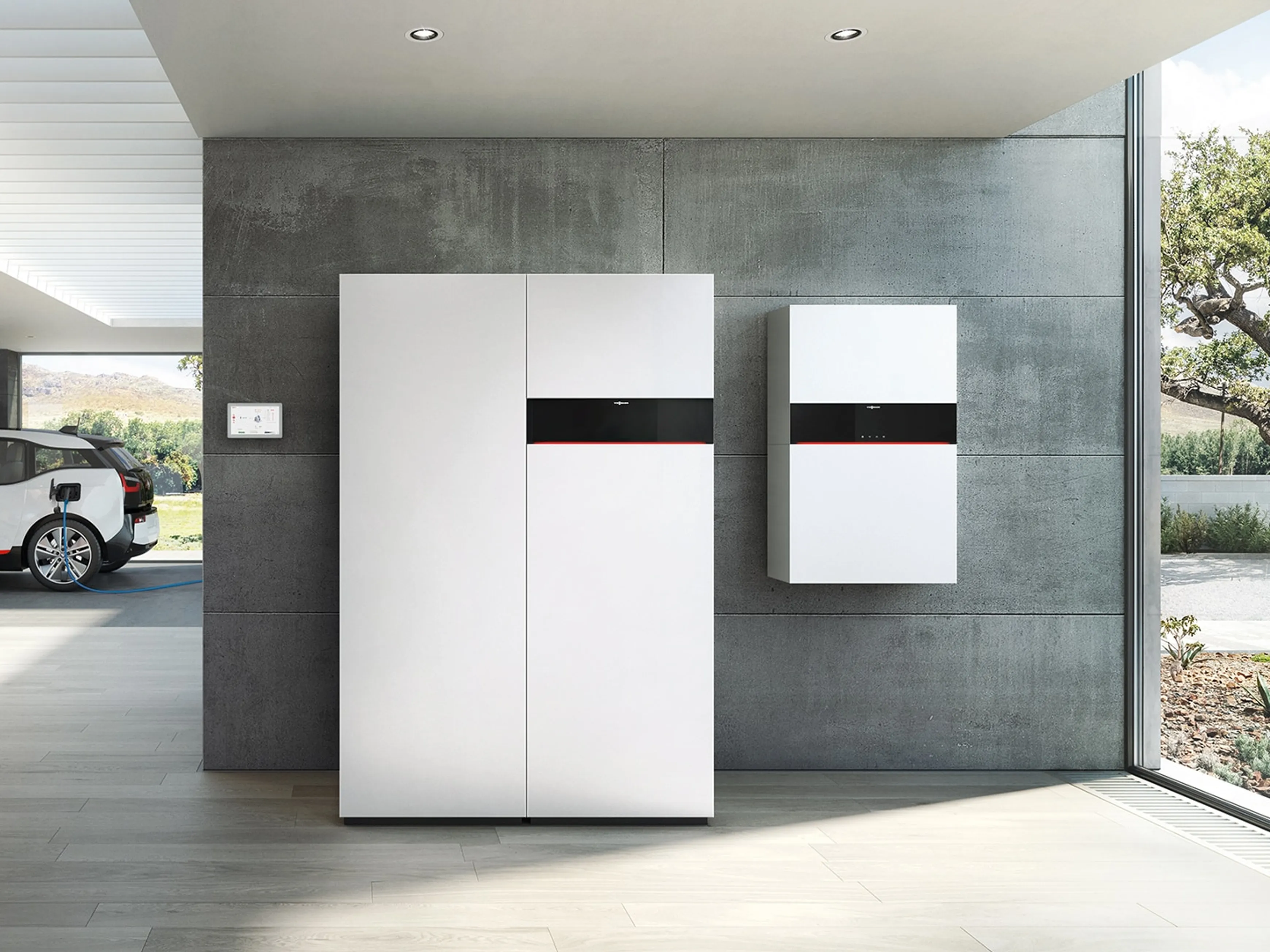 Viessmann Vitodens standing in a concrete garage with an EV in the background