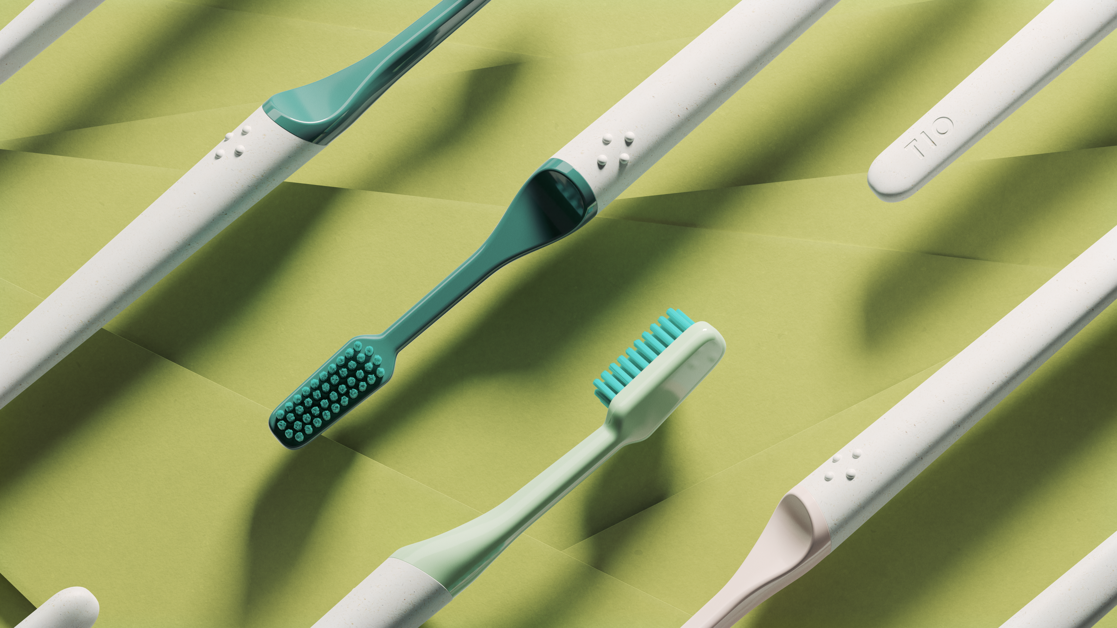 tio toothbrushes floating in front of a green background