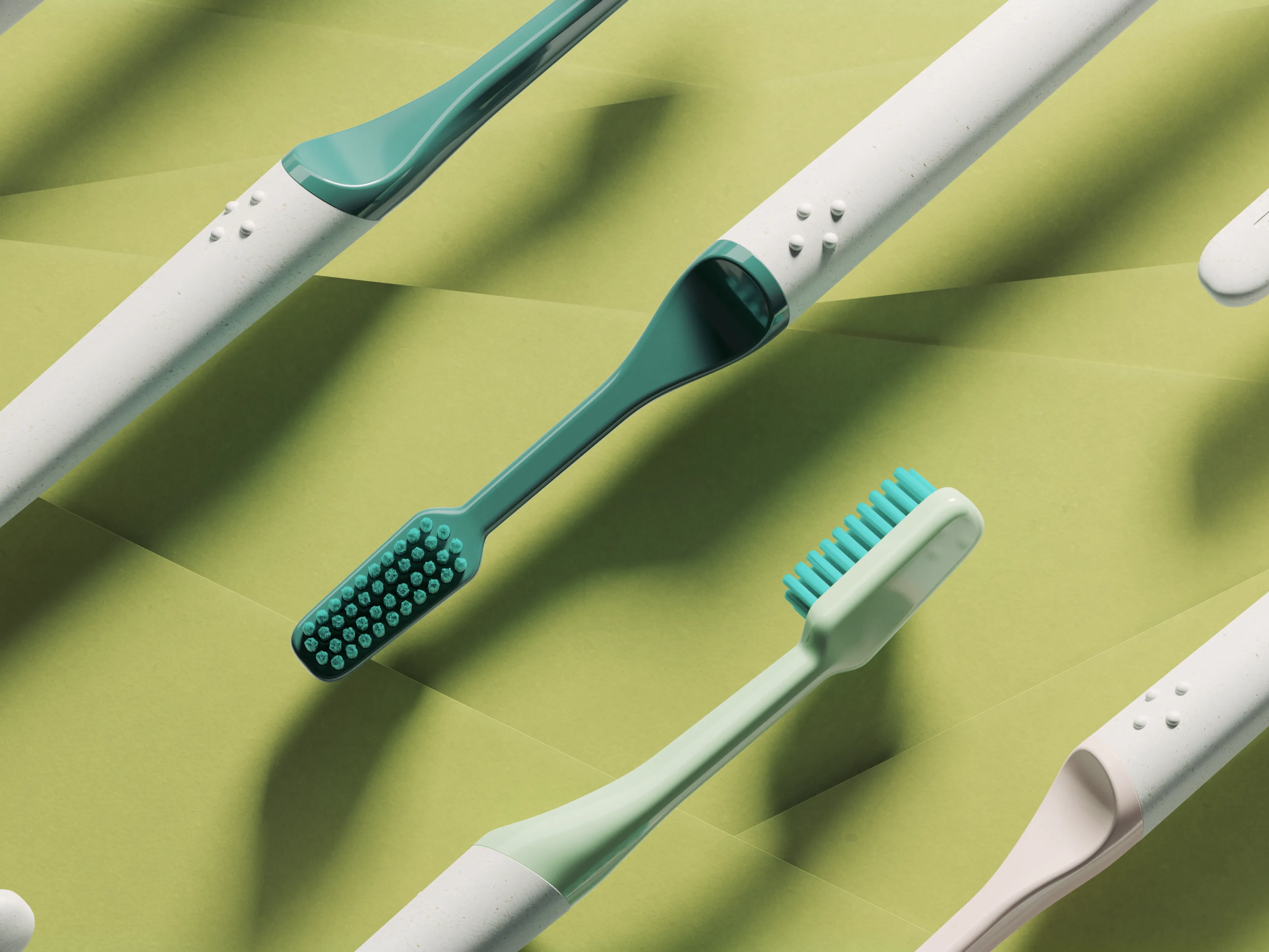 tio toothbrushes floating in front of a green background