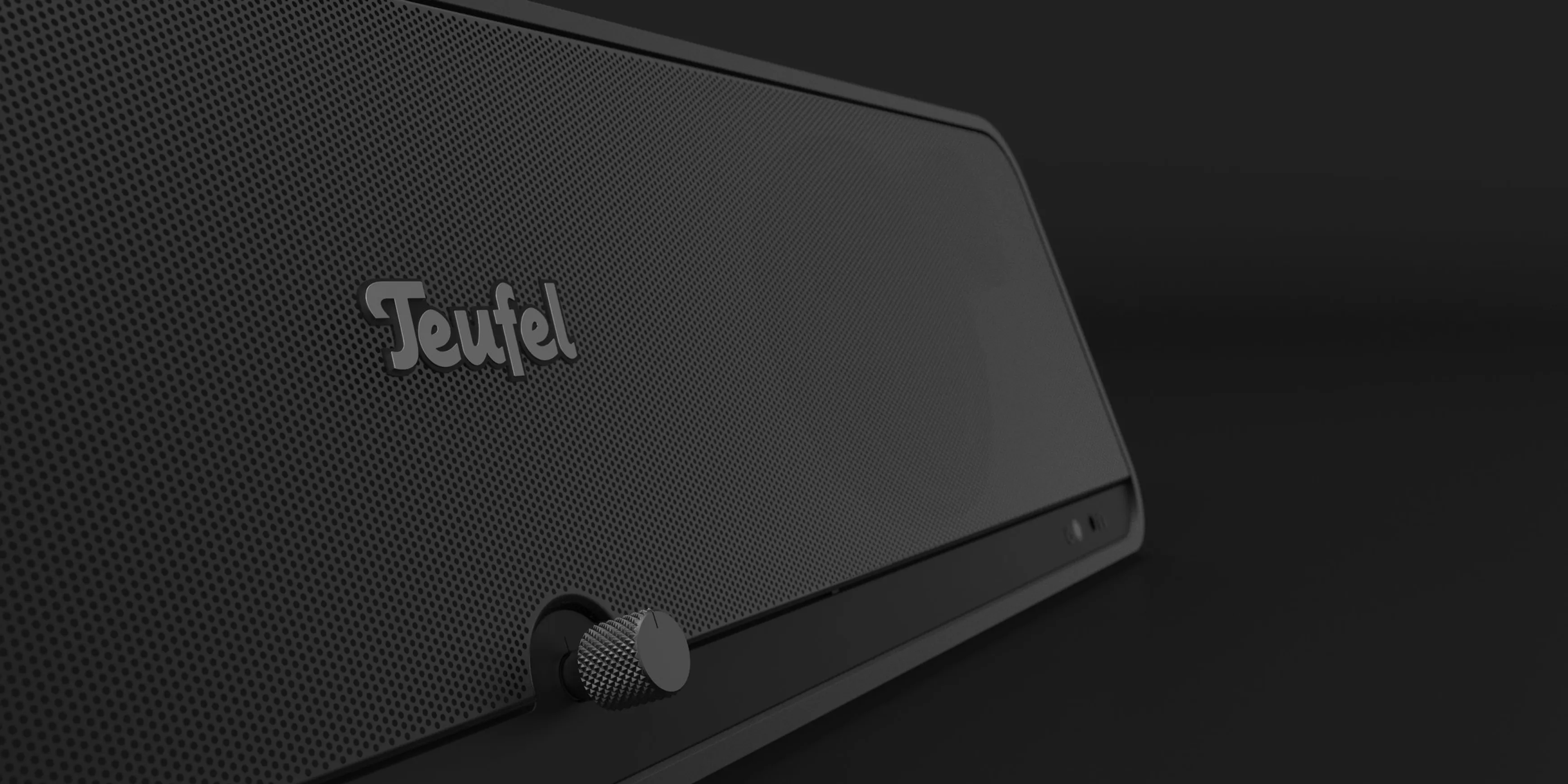 A detail shot of the Teufel Bamster speaker in front of a black background