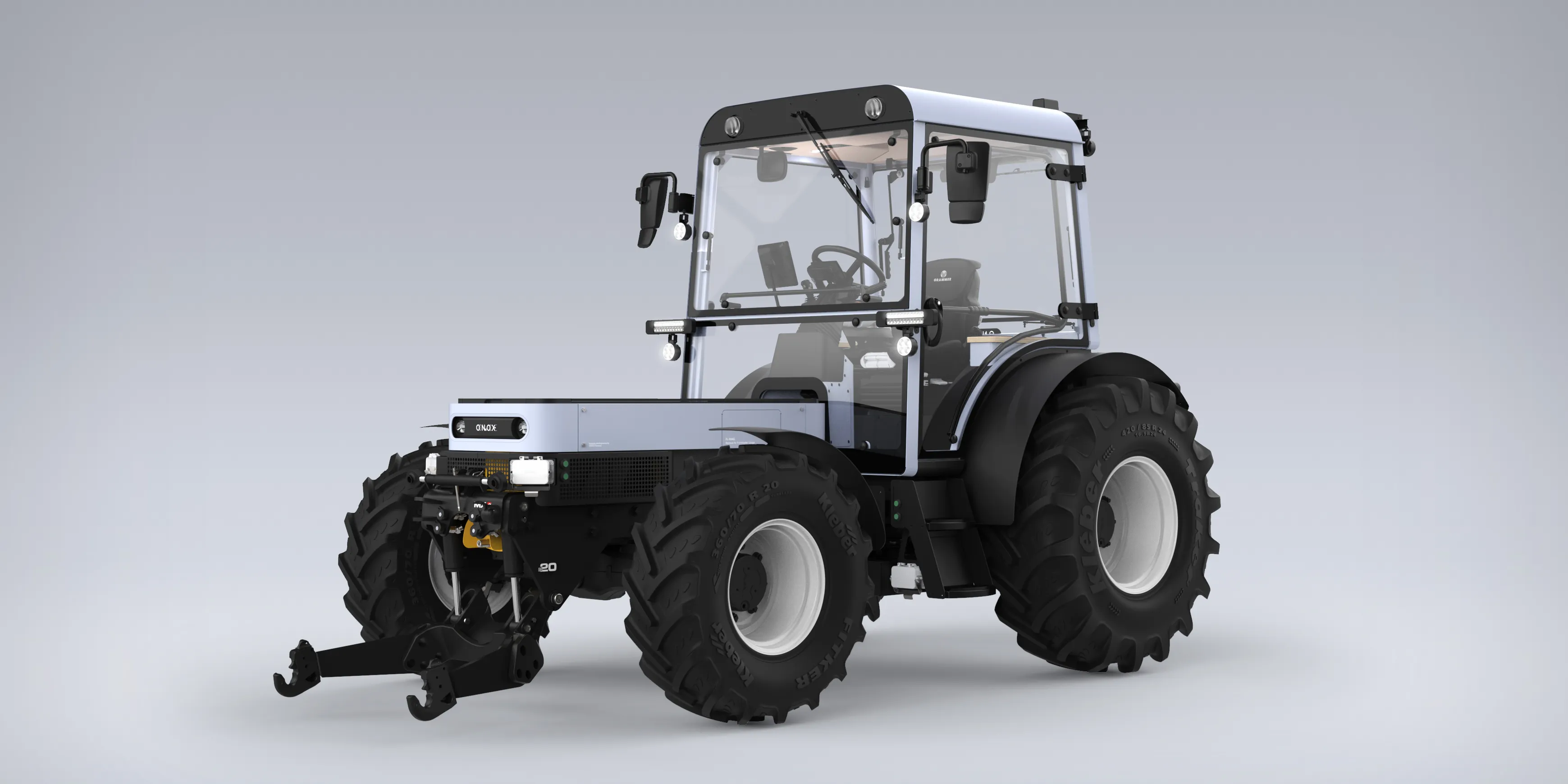A front perspective view of the Onox electric tractor on a blue background