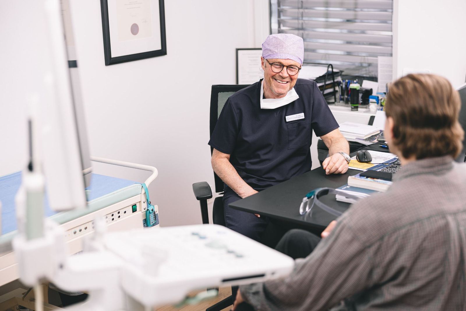 Urologist in consultation with a patient at CMedical
