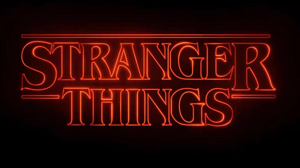 Stranger Things title treatment in glowing red ITC Benguiat lettering on a black background.