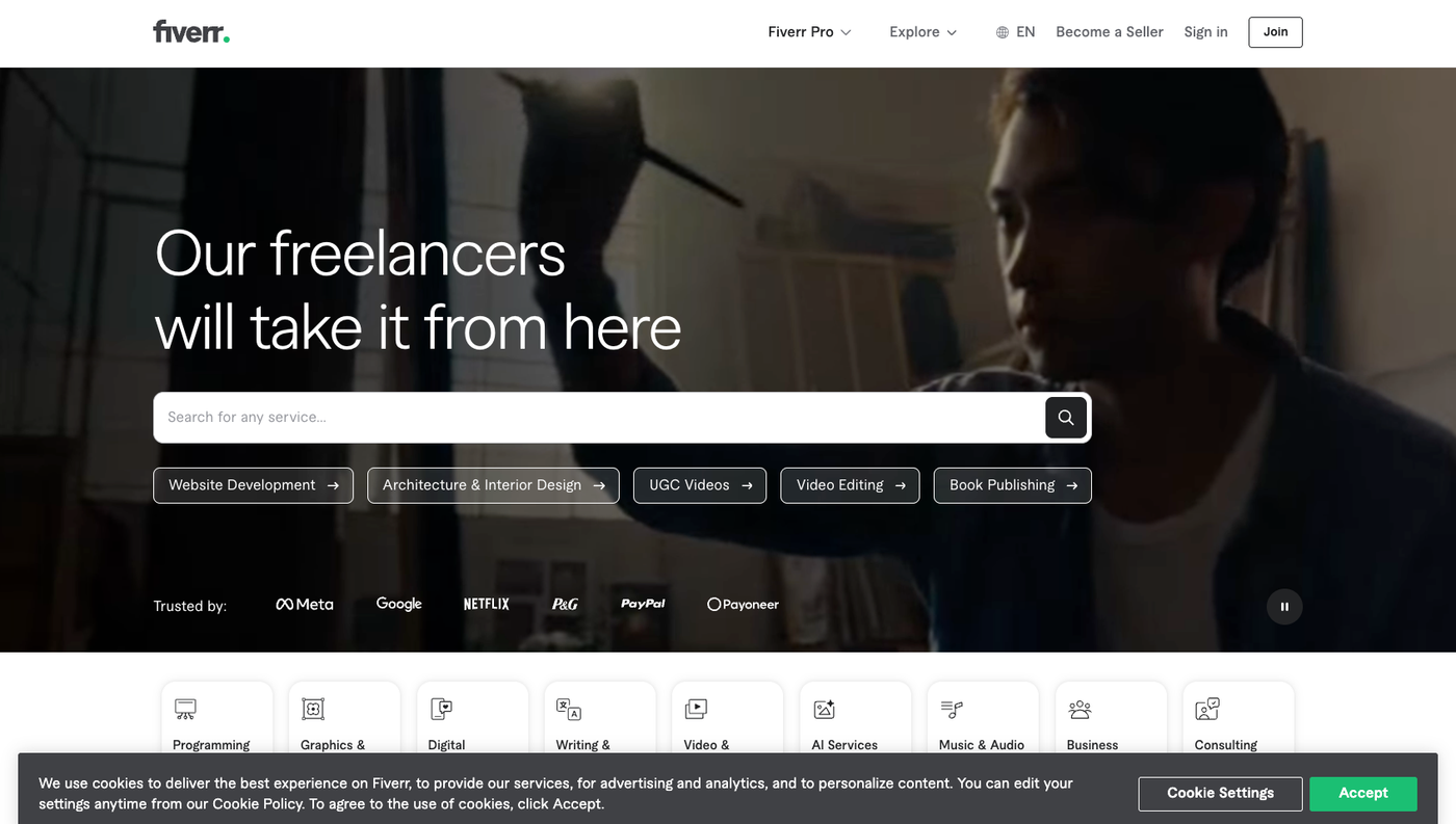 Screenshot of Fiverrâs homepage displayed on a desktop screen, showing the search bar and featured freelance service categories.