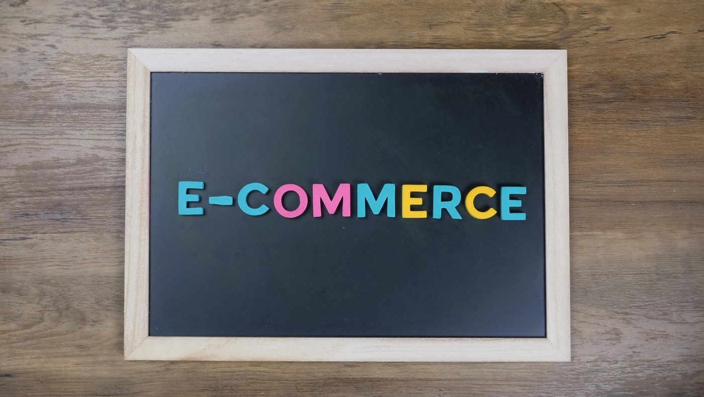 Small black boards with white letters spelling “e-commerce”.