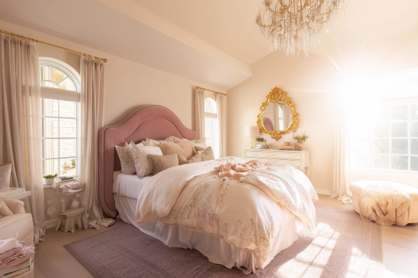 Romantic shabby chic bedroom glowing in golden hour light