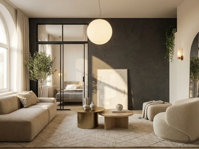 Luxury-style small contemporary studio with statement lighting, bold accent wall, and golden-hour sunlight.