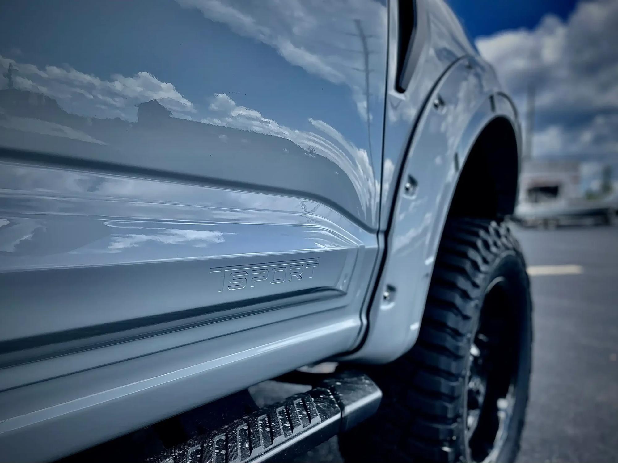 TSPORT F-150 close up of the side of a truck parked in a parking lot