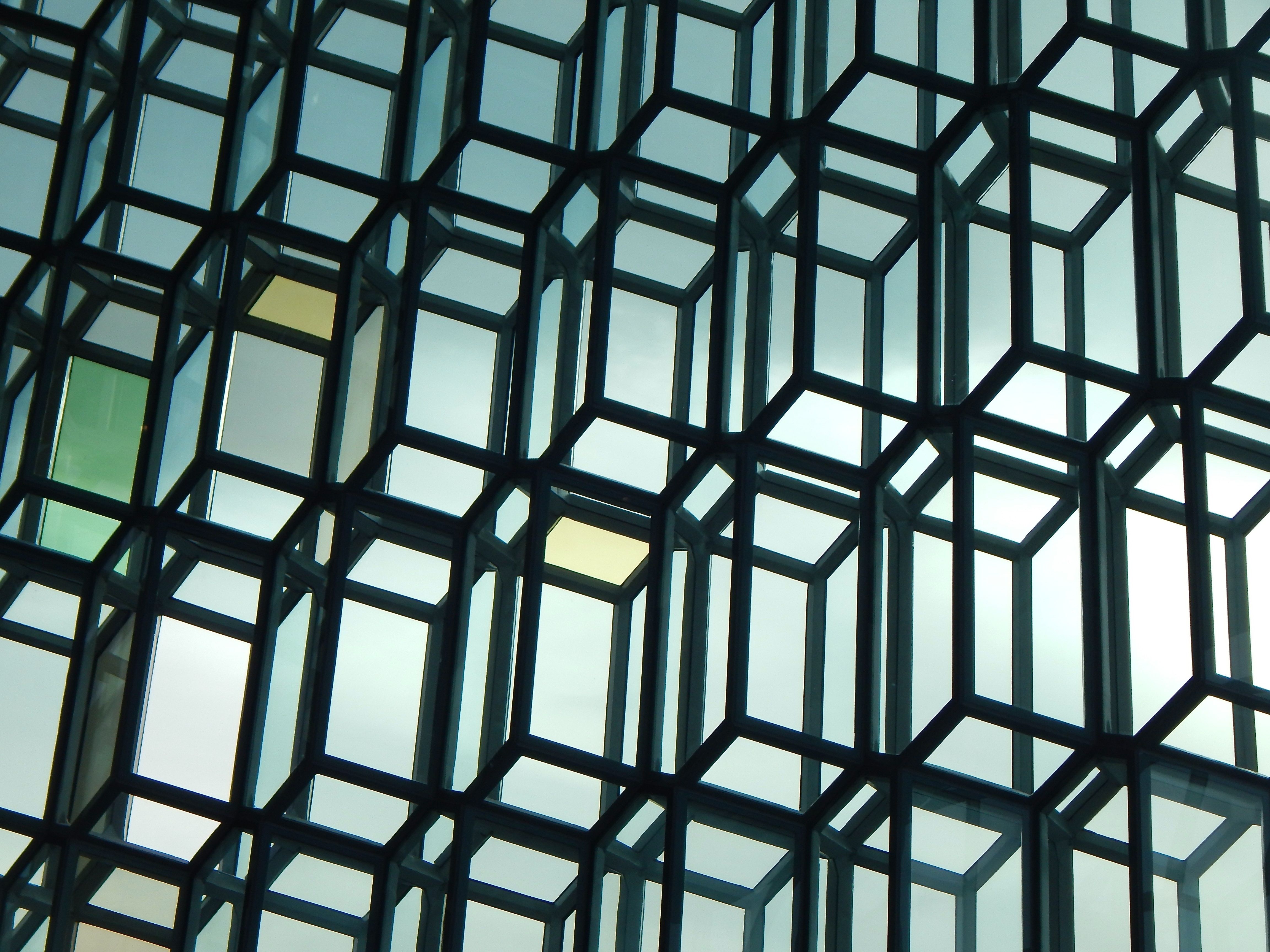 Image of Interior glass facade of the Harpa Concert Hall in Iceland.  by Clark Van Der Beken by Unsplash