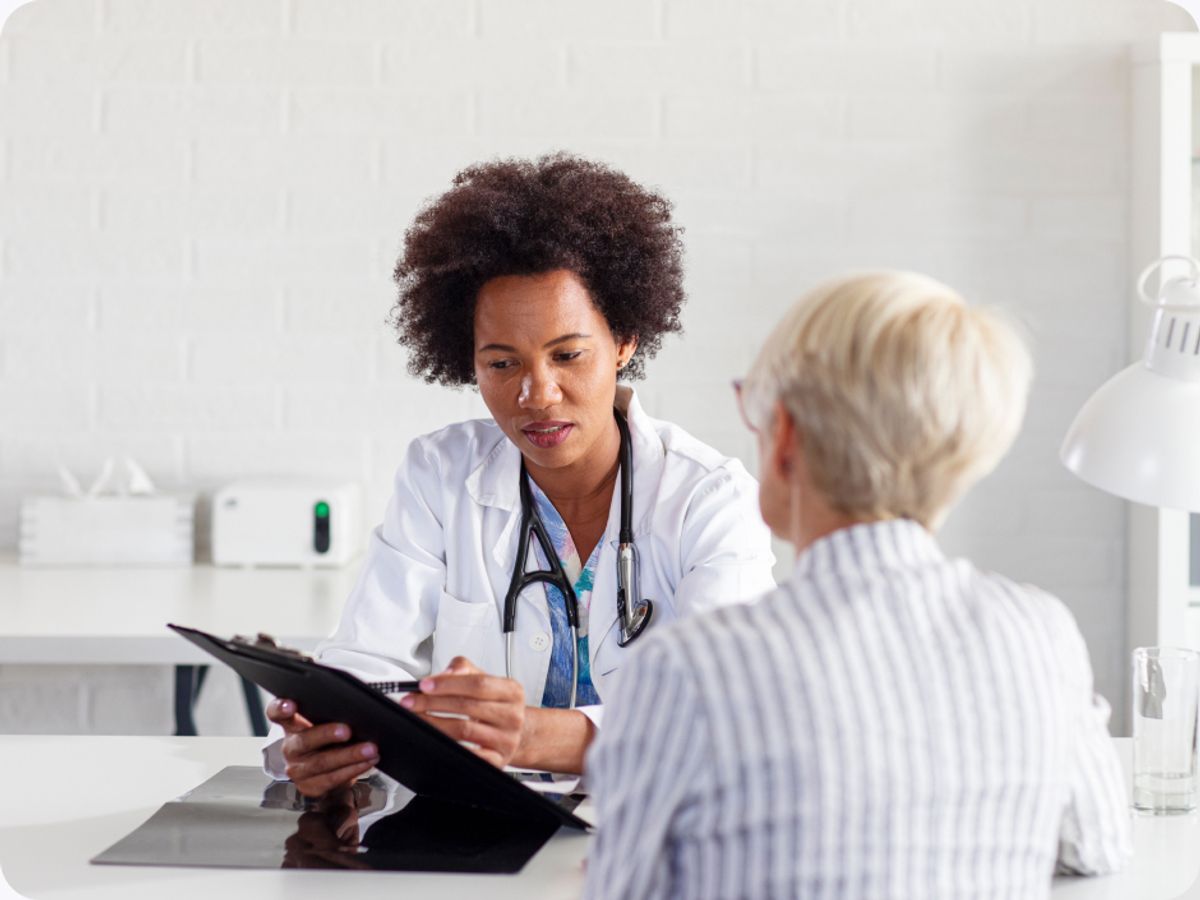 a doctor explains a chart to a patient