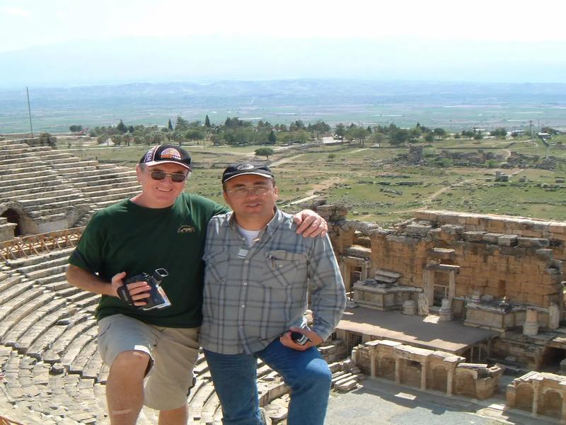 Two guests looking out over the ancient theatre of Ephesus from its upper rows on a private tour