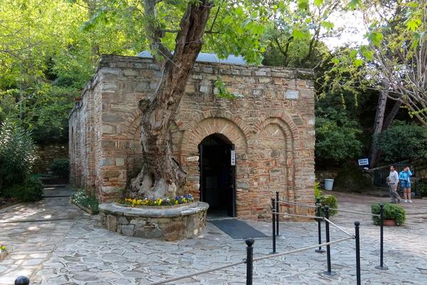 virgin mary house behind trees