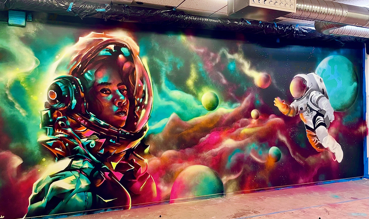 Astronaut — hand-painted mural by Spraya in Nya Ängkärrskolan, Sweden