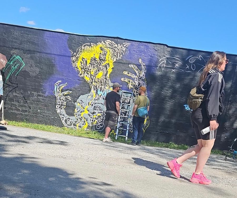 Burning Man — hand-painted mural by Spraya in Snösätra, Stockholm