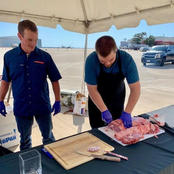 SMC team prepares to cook at Double Eagle Charities