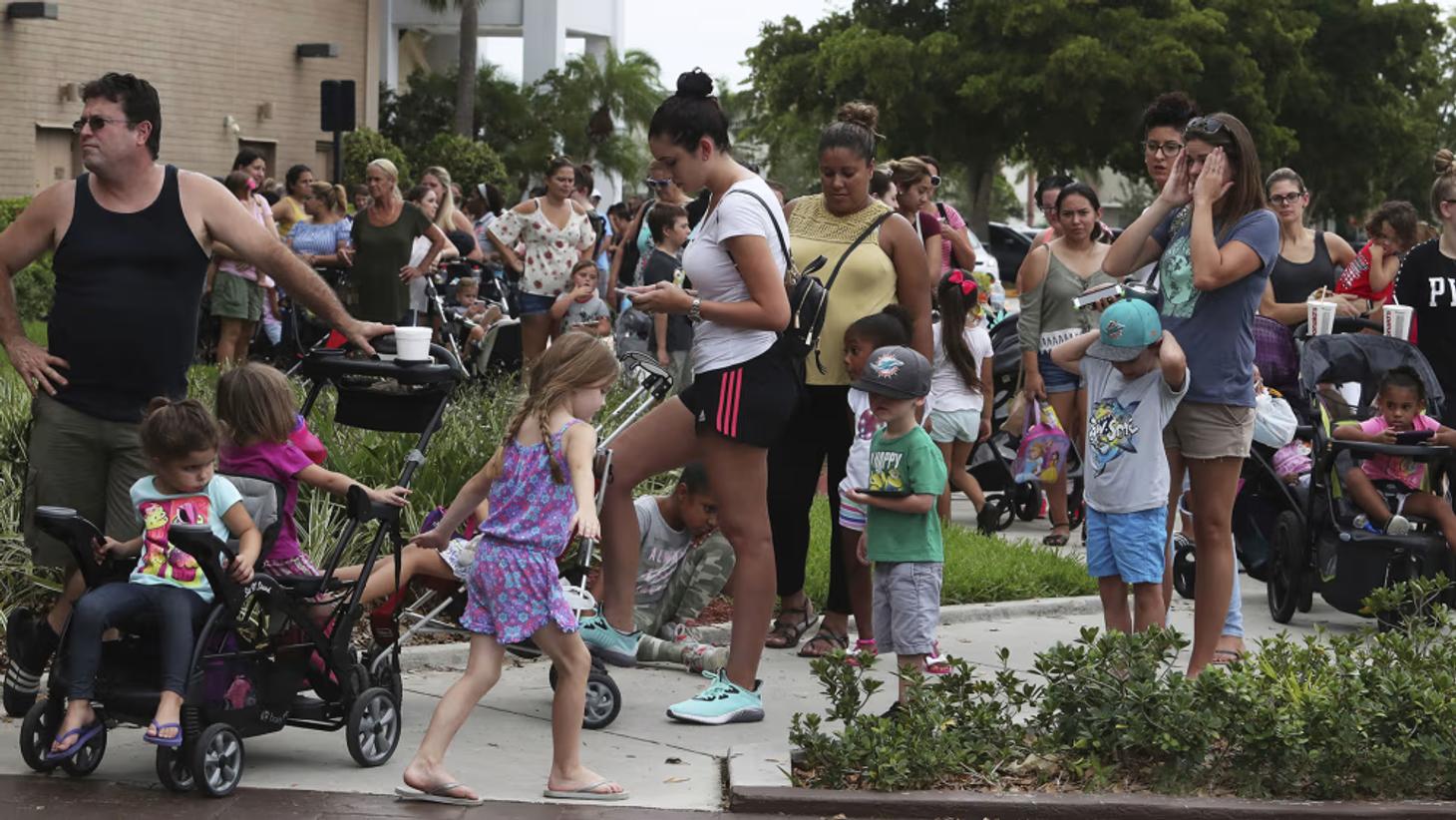 Parents and children queuing for Build-A-Bear's Pay Your Age day, a PR stunt that overwhelmed stores
