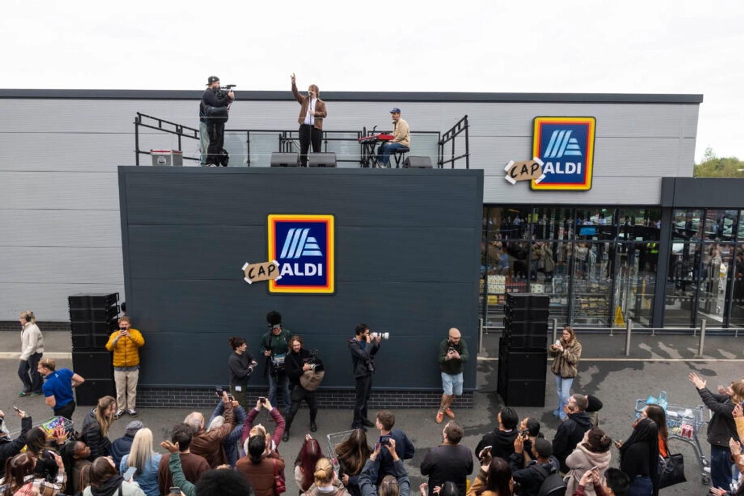 Crowd watching the Cap-Aldi rooftop gig outside a rebranded Nottingham Aldi store
