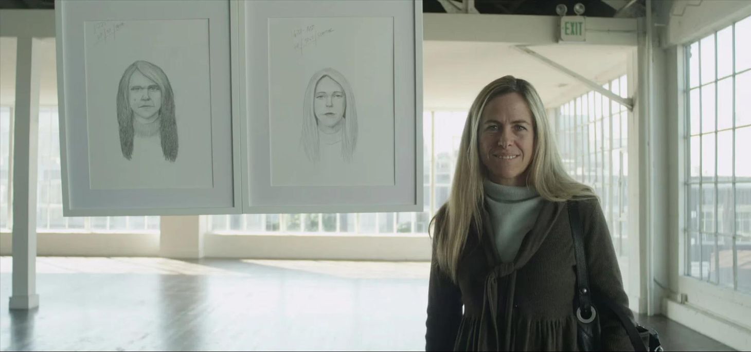 A woman smiling next to forensic sketches of her for Dove’s emotional advertising campaign