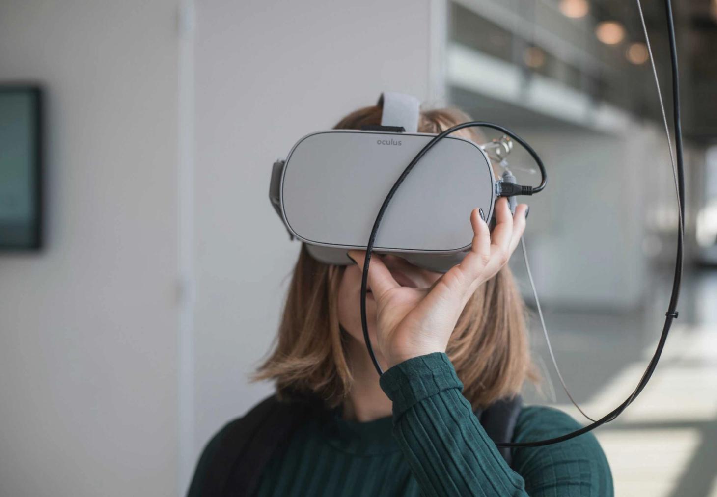 Image showing a woman wearing a VR headset, showcasing experiential marketing campaigns