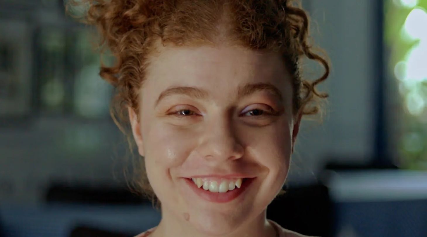A young woman smiling in Mencap’s emotional advertising campaign