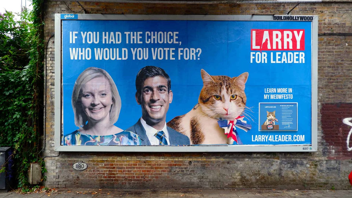 A billboard for the Larry 4 Leader campaign showing Larry the cat, Liz Truss and Rishi Sunak