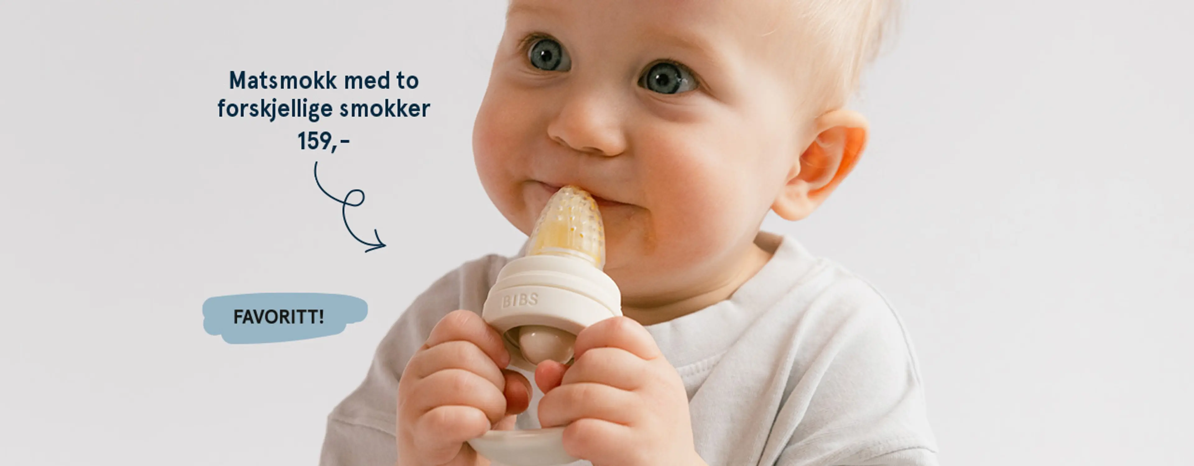 Fotografi av barn med en matsmokk fra BIBS i hendene - favoritt!