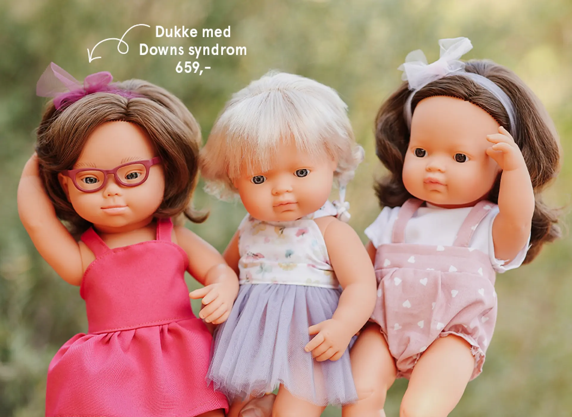 Fotografi av to miniland dukker. Jentedukke med Downs syndrom 499 kr.
