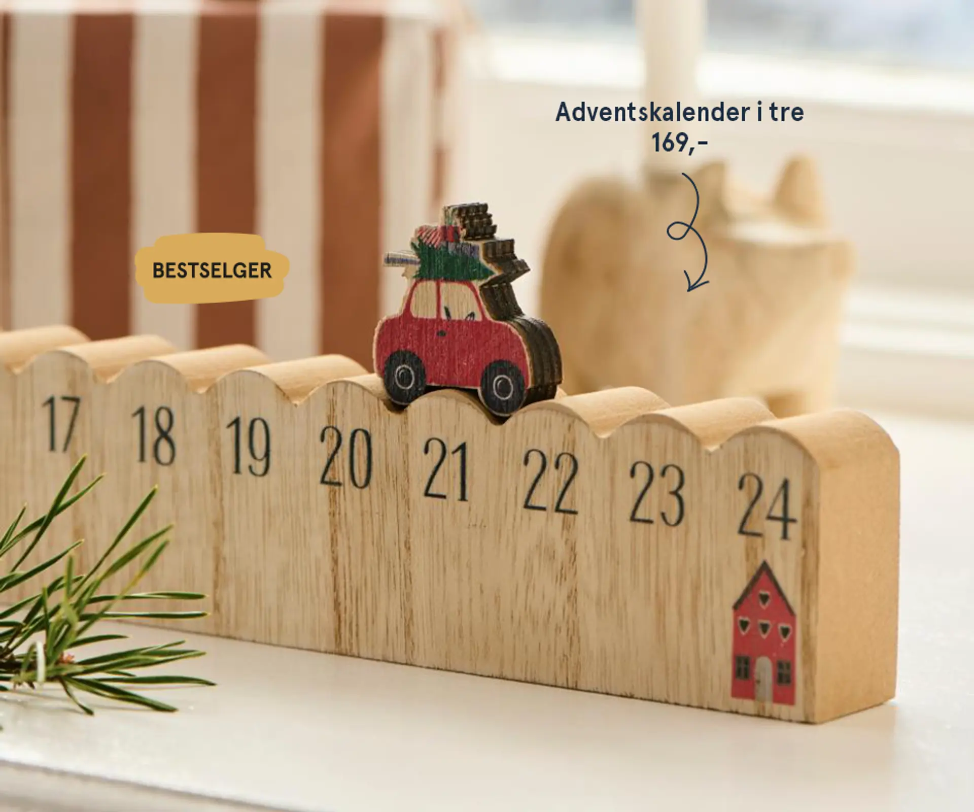 Nærbilde av Julekula fra Snøfall som lyser opp når man blåser på den, 359,- med teksten "Adventskos - dette gir den deilige julestemningen"