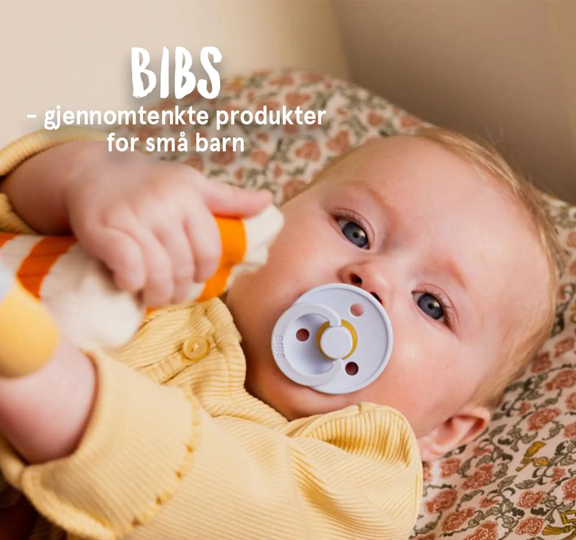 BIBS - gjennomtenkte produkter for små barn. Fotografi av baby med en BIBS smokk.