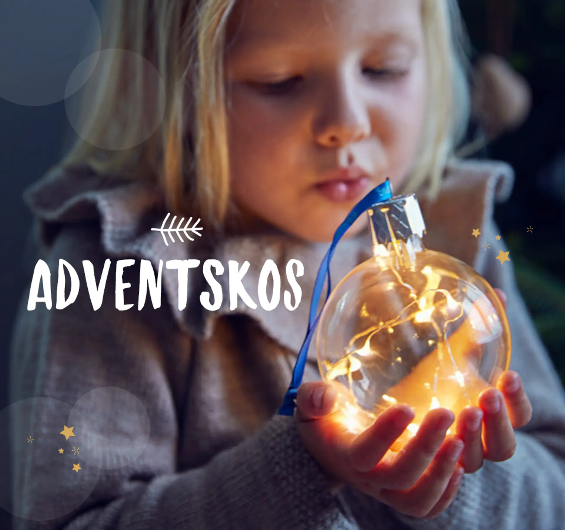 Nærbilde av Julekula fra Snøfall som lyser opp når man blåser på den, 359,- med teksten "Adventskos - dette gir den deilige julestemningen"