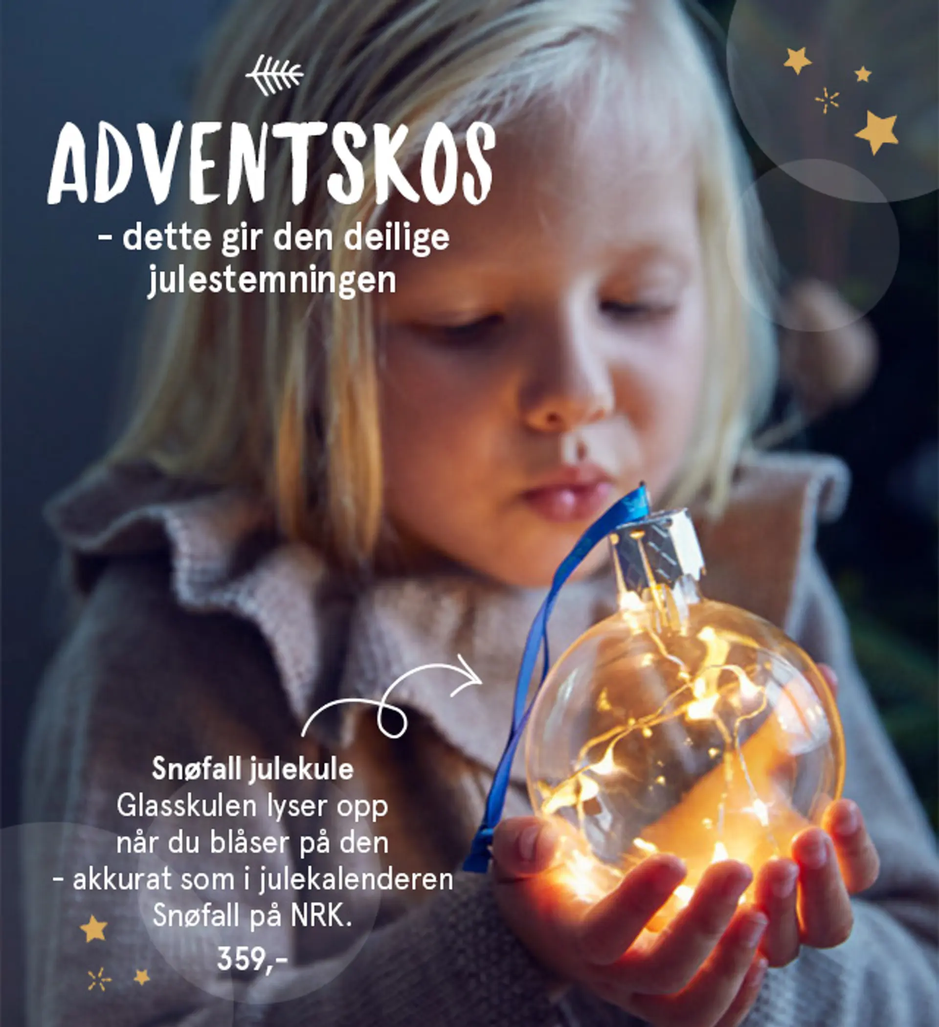 Nærbilde av Julekula fra Snøfall som lyser opp når man blåser på den, 359,- med teksten "Adventskos - dette gir den deilige julestemningen"