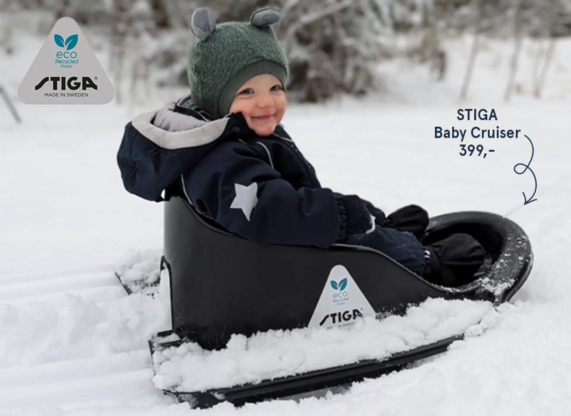 Fotografi av barn som aker i snøen med STIGA Baby Cruiser.