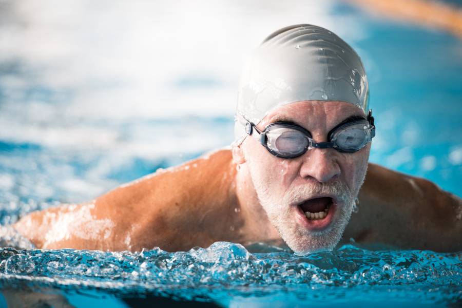 Older man swimming