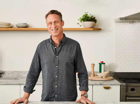 An image of a smiling Dr. Mark Hyman in his kitchen