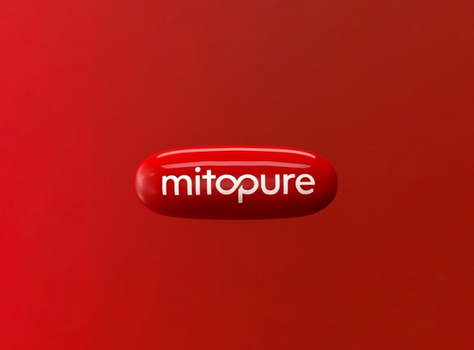A red pill with "mitopure" written on it. It is floating on a red background.