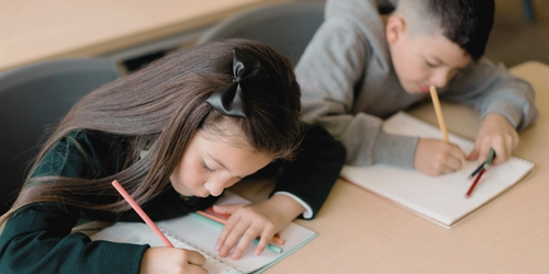 Students working through their vocabulary curriculum in the classroom.