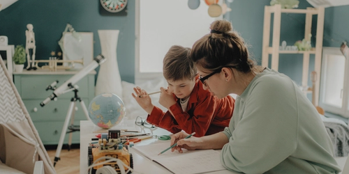 A parent and child improving literacy at home.